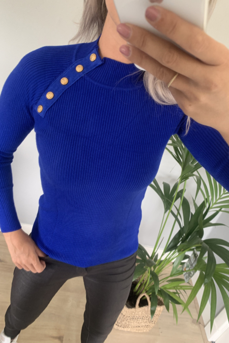 Blauwe top met gouden knopen